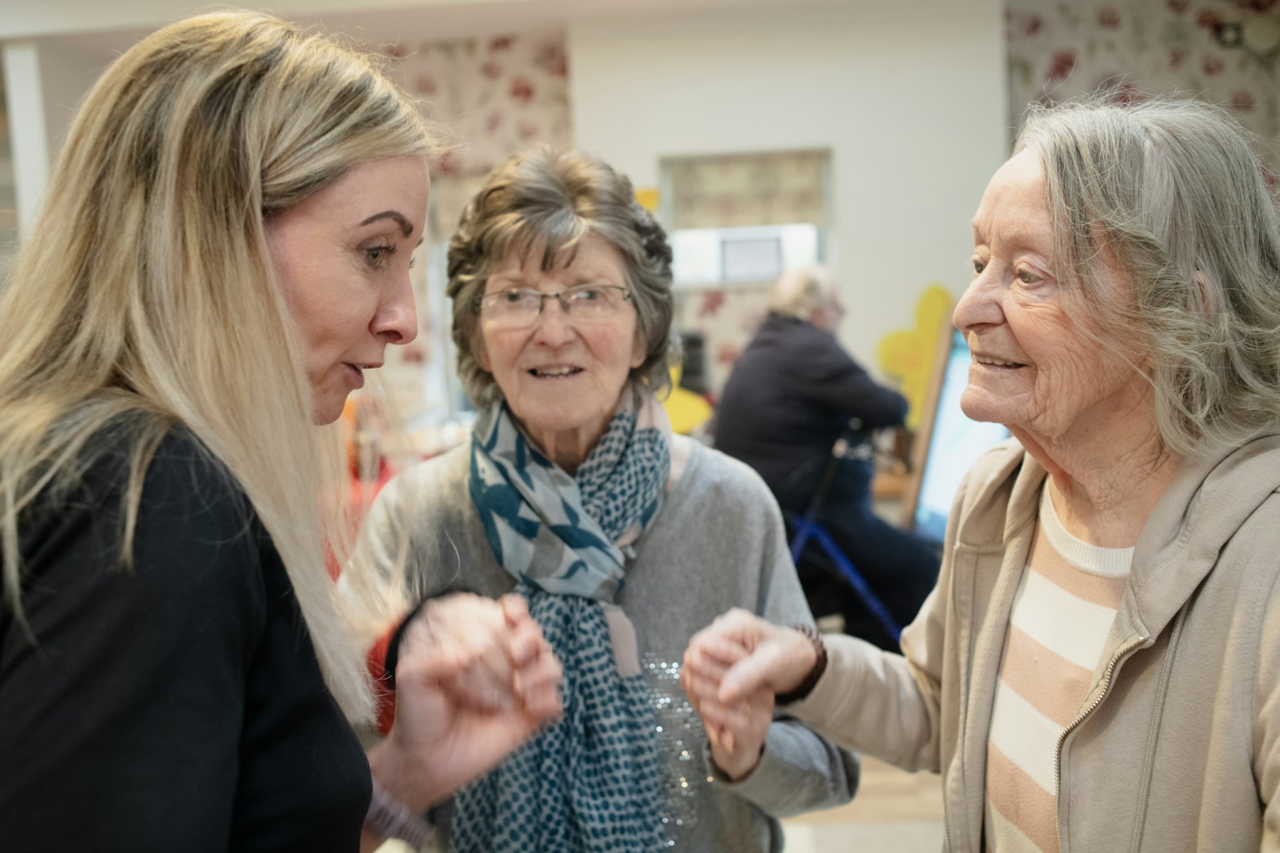 People talking together in a care setting